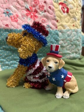 Patriotic dogs decorated with red, white, and blue colors for the 4th of July